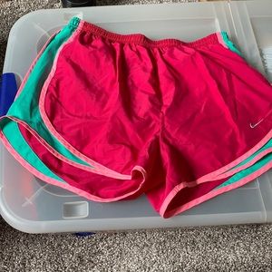 Pink and green Nike dry fit running shorts